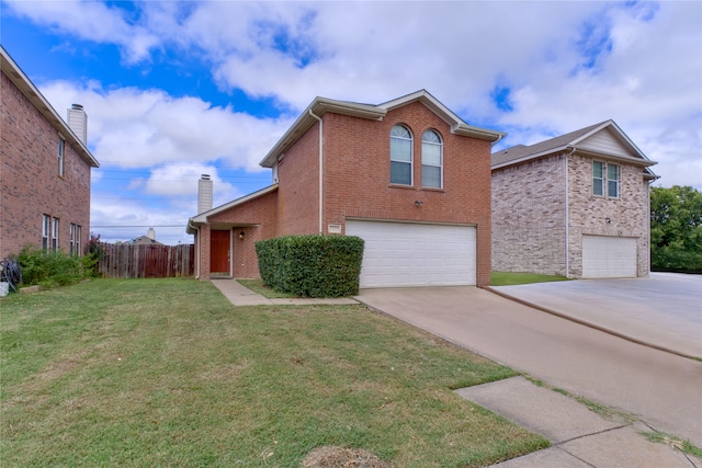 view of front of property with a front lawn and a garage