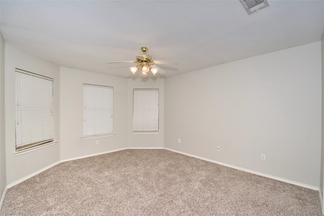 empty room with carpet and ceiling fan