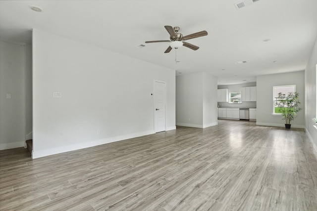 unfurnished living room featuring ceiling fan and light wood-type flooring