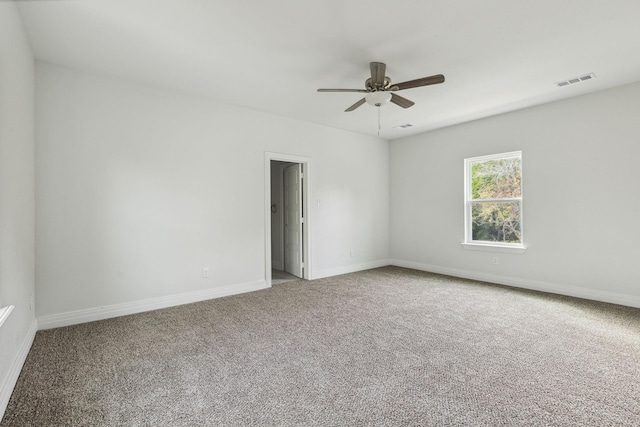 unfurnished room featuring carpet flooring and ceiling fan