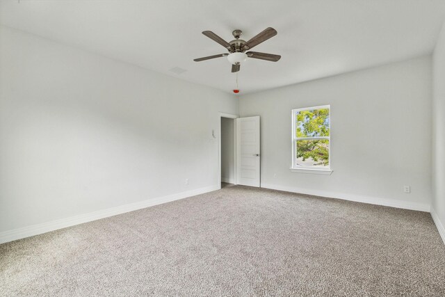 unfurnished room with carpet floors and ceiling fan