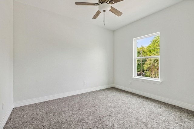 empty room featuring carpet floors and ceiling fan