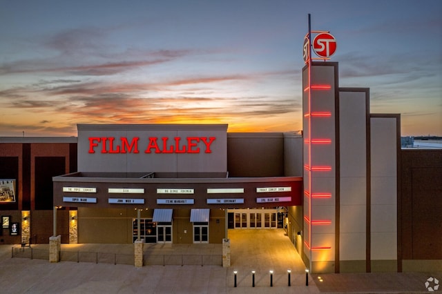 view of outdoor building at dusk