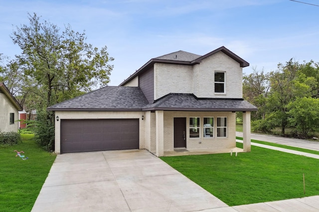 view of front of home with a garage and a front yard