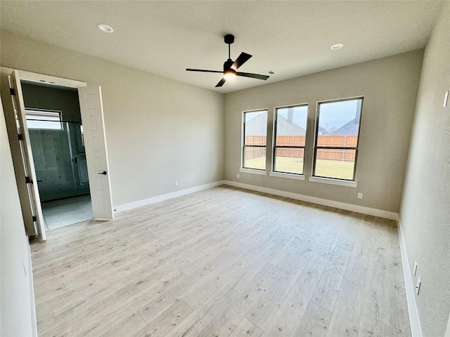 unfurnished room featuring light wood-type flooring and ceiling fan