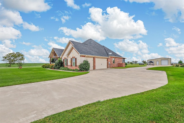 view of front of house with a garage and a front lawn