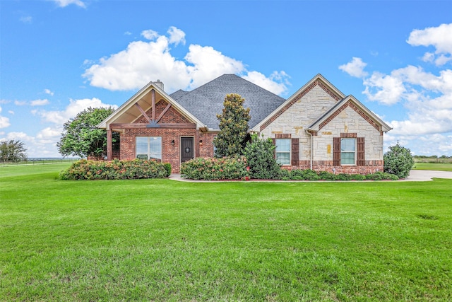 craftsman-style house with a front yard