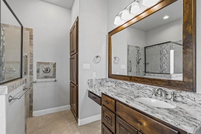 bathroom featuring vanity and a tile shower