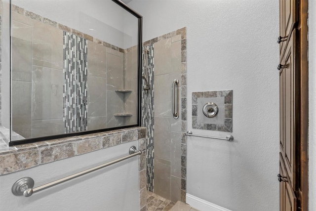 bathroom with a tile shower