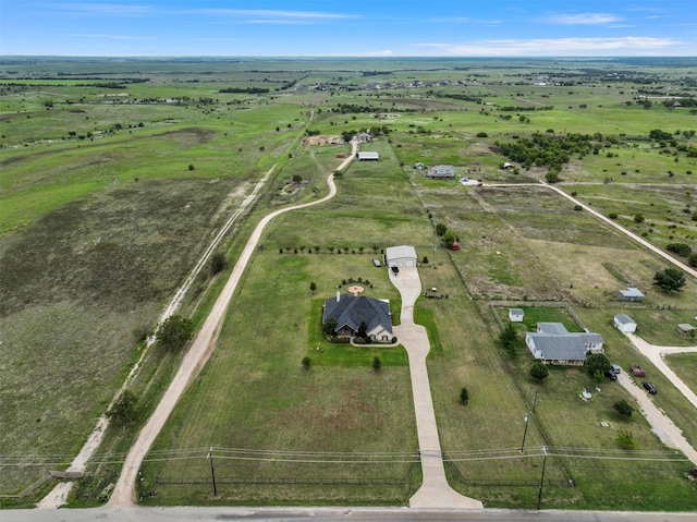 birds eye view of property with a rural view