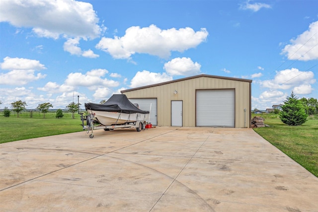 garage featuring a yard