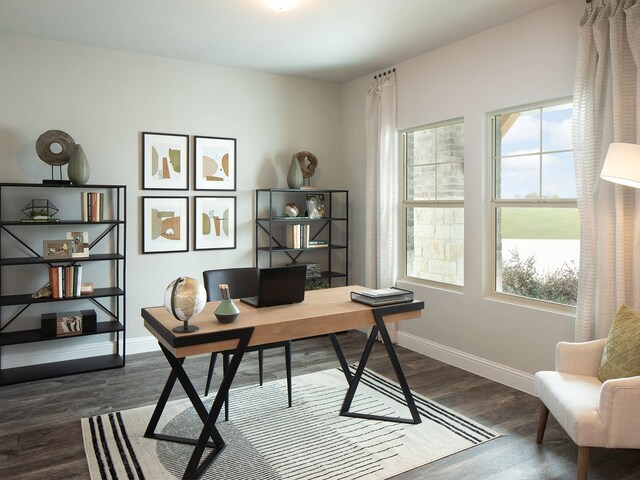 home office featuring plenty of natural light and dark hardwood / wood-style floors