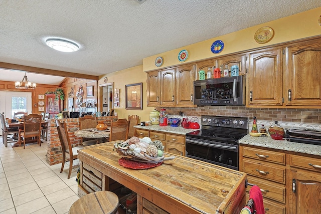 kitchen featuring vaulted ceiling with beams, a chandelier, a textured ceiling, and black electric range oven