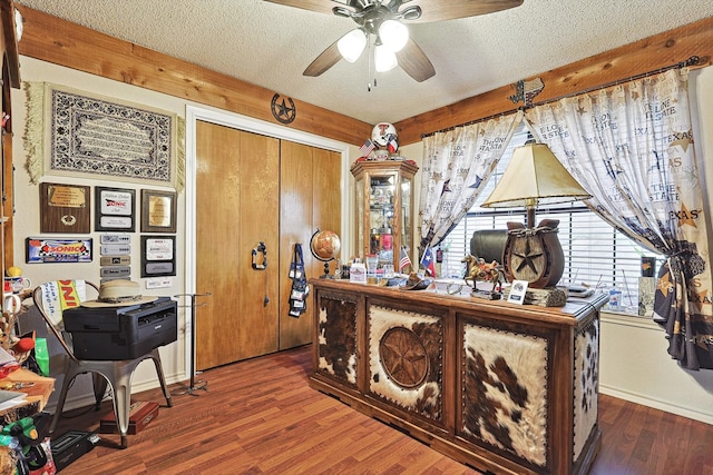 home office featuring a textured ceiling, wood-type flooring, and ceiling fan