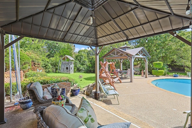 view of patio / terrace with a gazebo and a storage shed