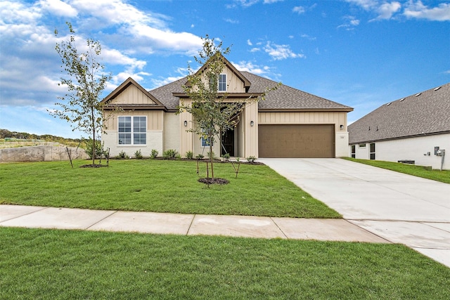 view of front of house featuring a front yard and a garage