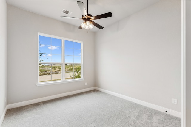 carpeted empty room with ceiling fan