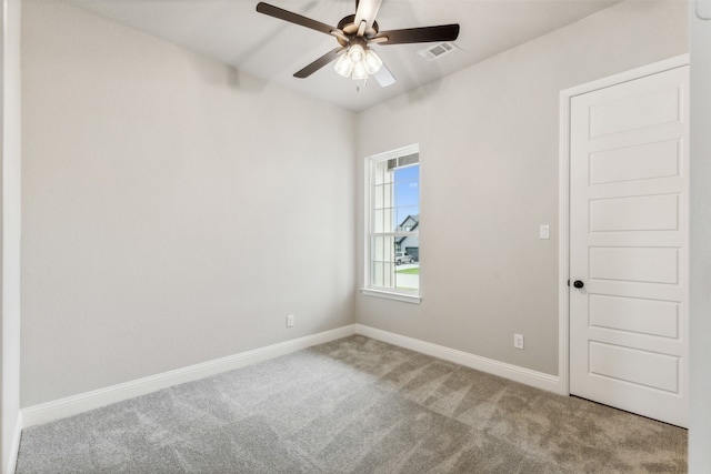 unfurnished room with light carpet and ceiling fan