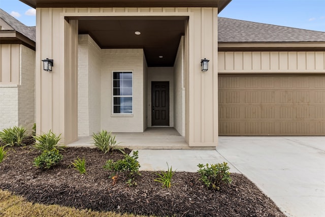 view of exterior entry featuring a garage