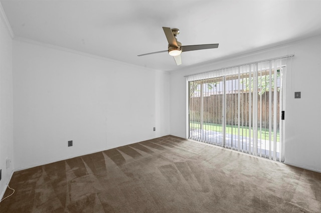 carpeted spare room with ceiling fan and crown molding