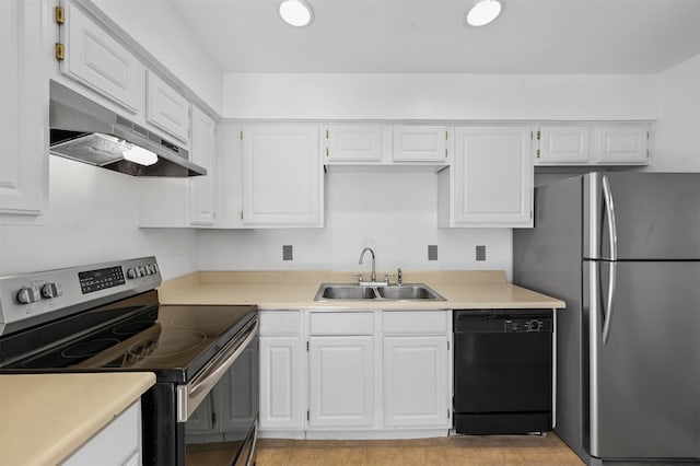 kitchen with stainless steel appliances, white cabinets, light tile patterned floors, and sink