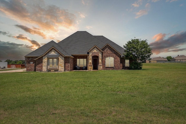 view of front of property with a yard