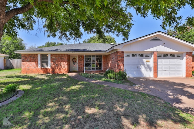 single story home featuring a garage and a front lawn