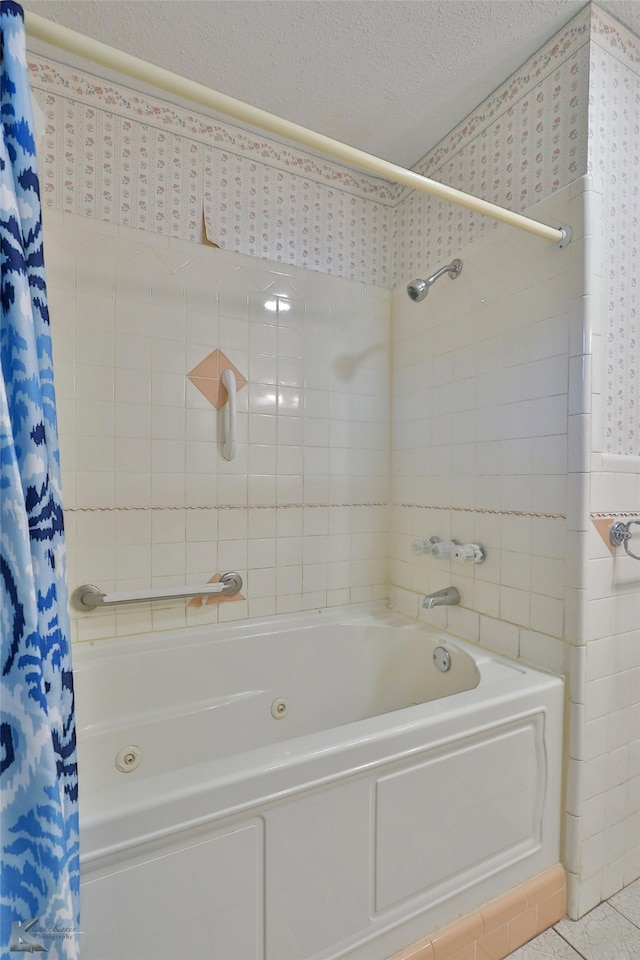 bathroom featuring a textured ceiling, shower / bath combo, and tile patterned floors