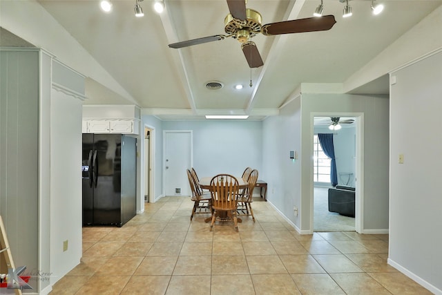 tiled dining space featuring ceiling fan