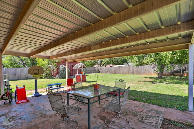 view of patio featuring a shed