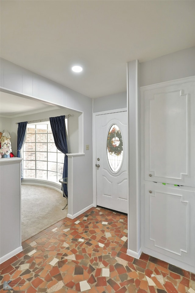 view of carpeted entrance foyer