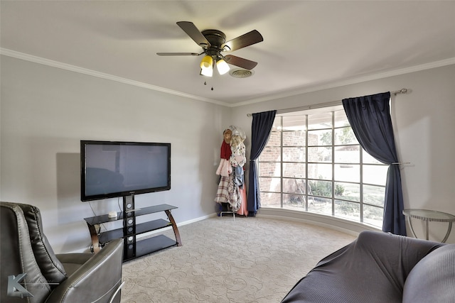 carpeted living room with crown molding and ceiling fan