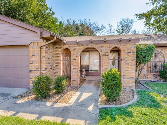 property entrance with a garage