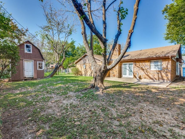 view of yard with a patio and a shed