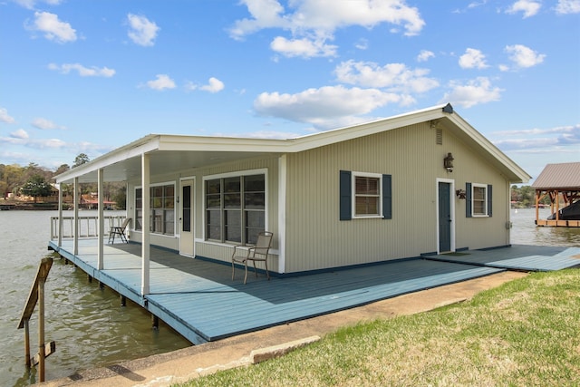 back of house with a water view