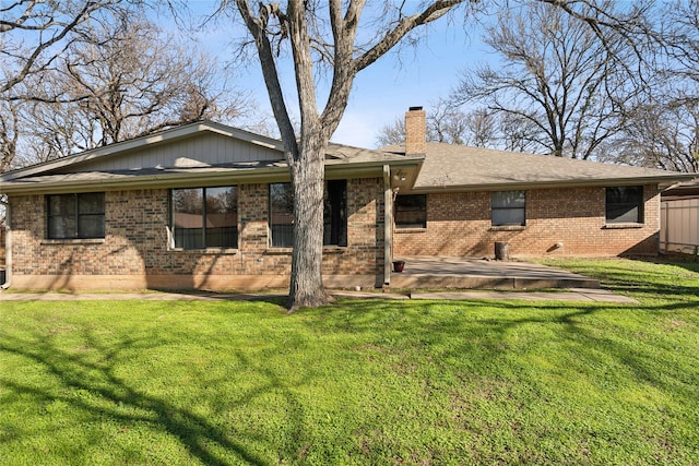 back of house featuring a yard