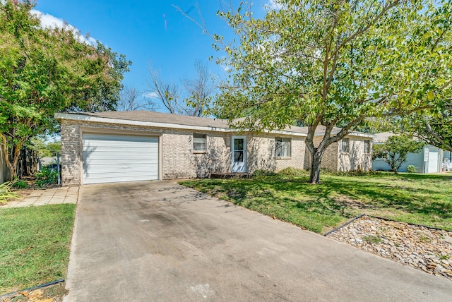 single story home featuring a front yard and a garage