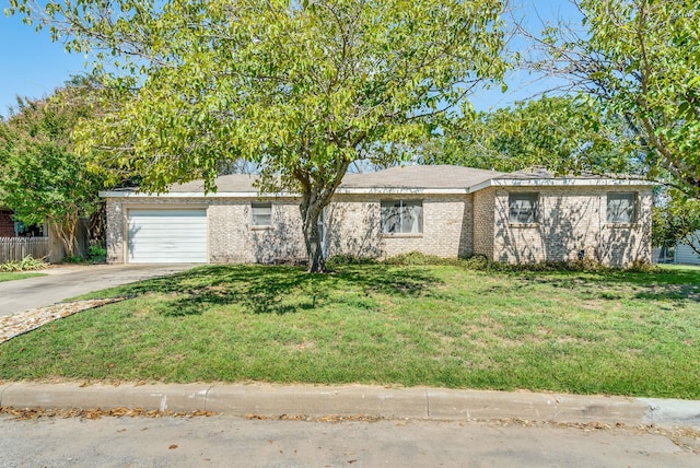 view of front of house with a front lawn and a garage