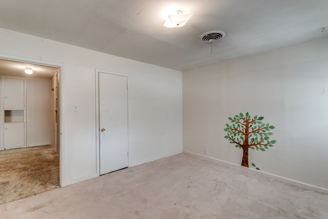 spare room with light colored carpet