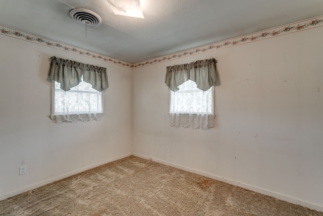 unfurnished room with carpet flooring