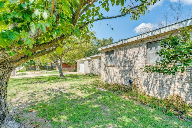 view of yard with a garage