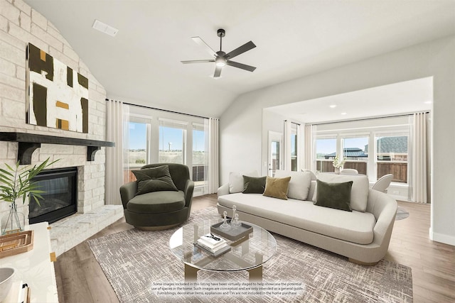 living room with a fireplace, lofted ceiling, ceiling fan, and wood-type flooring