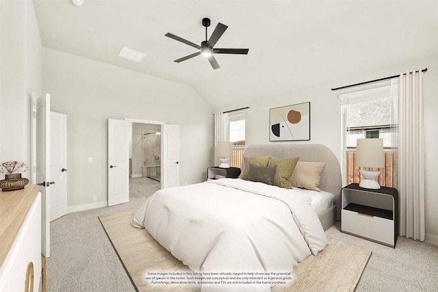 carpeted bedroom featuring ceiling fan, ensuite bathroom, multiple windows, and lofted ceiling