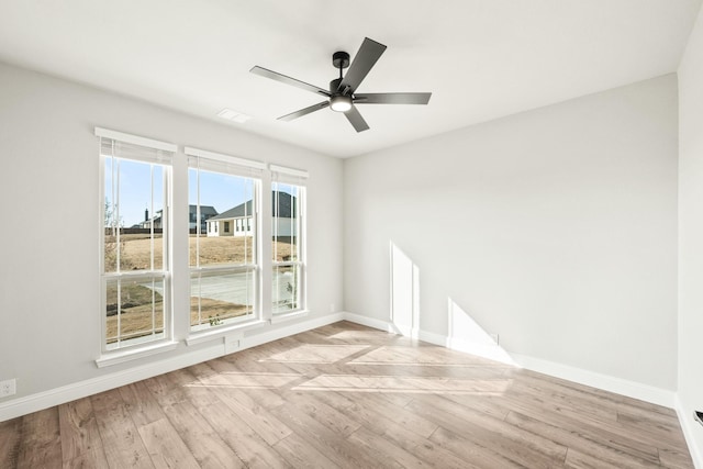 unfurnished room with ceiling fan and light hardwood / wood-style floors