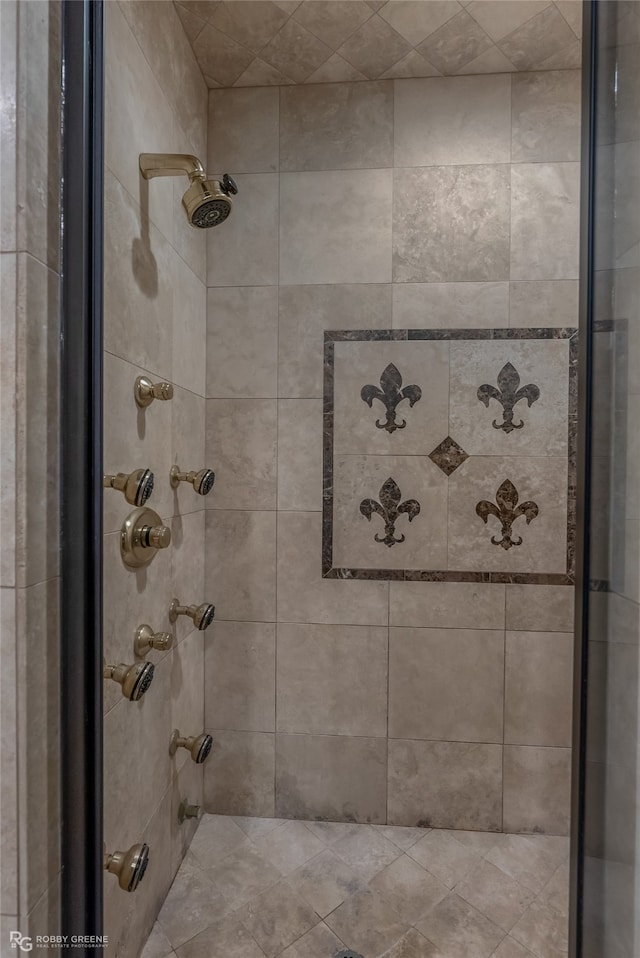 bathroom with tiled shower