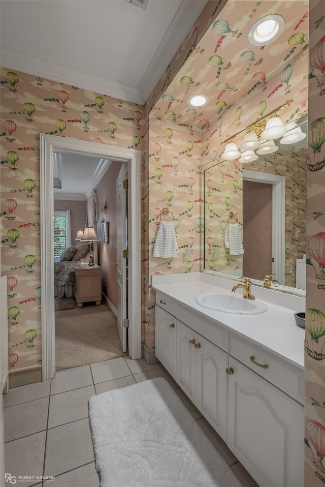 bathroom featuring tile patterned floors, vanity, and crown molding