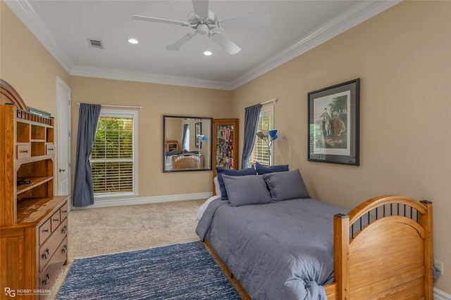 bedroom featuring ceiling fan, light carpet, and crown molding