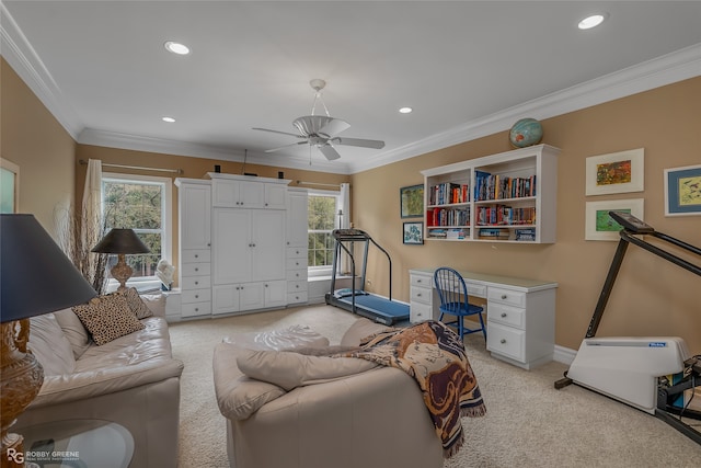 carpeted living room featuring ornamental molding and ceiling fan