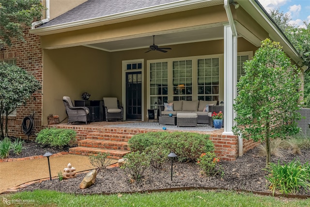 back of house with ceiling fan, an outdoor hangout area, and a patio area