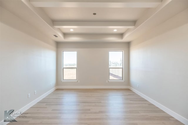 spare room with a wealth of natural light, light wood-style flooring, baseboards, and recessed lighting